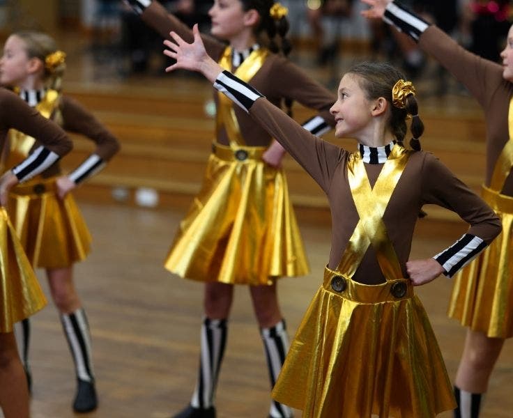 Three girls in a dance pose